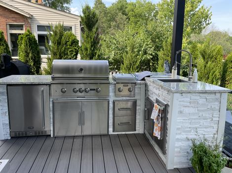 l shaped grill island with dual burner refrigerator sink and storage on deck in stacked stone chalk finish-2