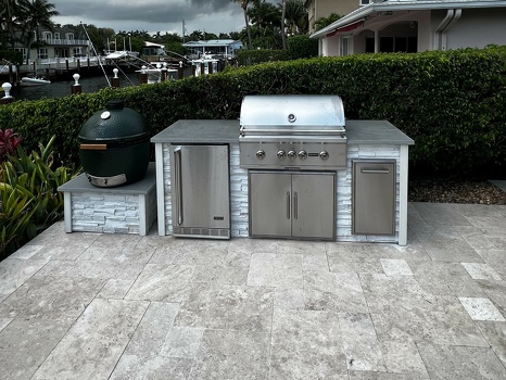 linear grill island with green egg stand add on in stacked stone chalk