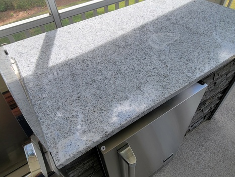 close up of venetian gold granite countertop on grill island