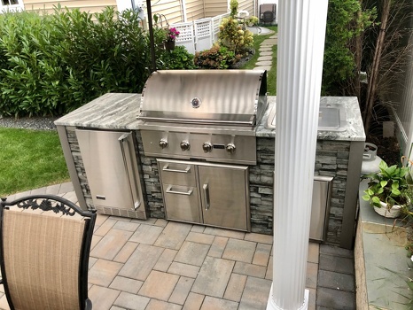 linear grill island with combo storage and refrigerator in stacked stone graphite-2
