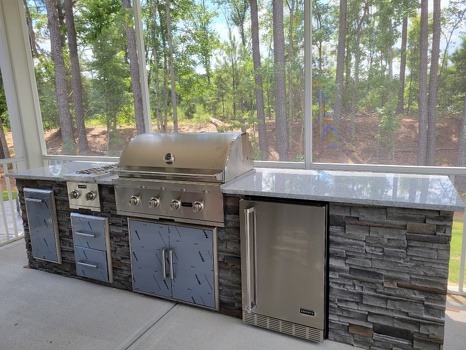 linear grill island with dual burner refrigerator and storage on patio in stacked stone graphite finish-4