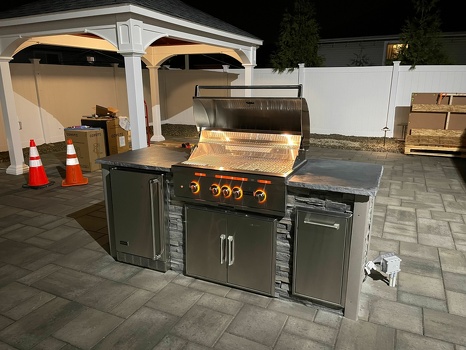 linear grill island with refrigerator and pull out trash on patio in stacked stone graphite finish-1